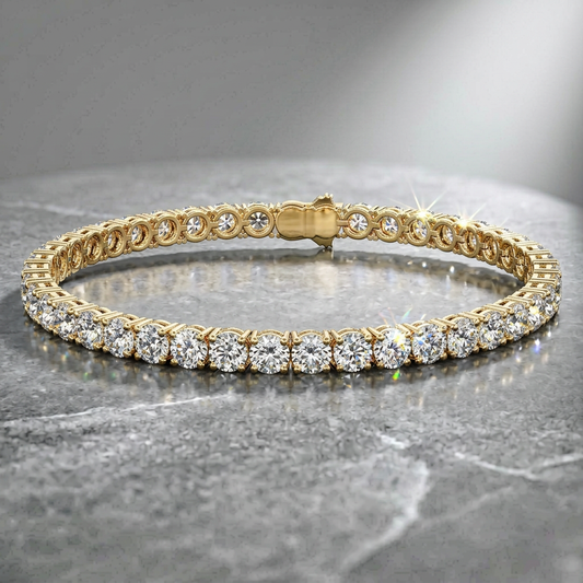 Gold bracelet with diamonds on a gray surface
