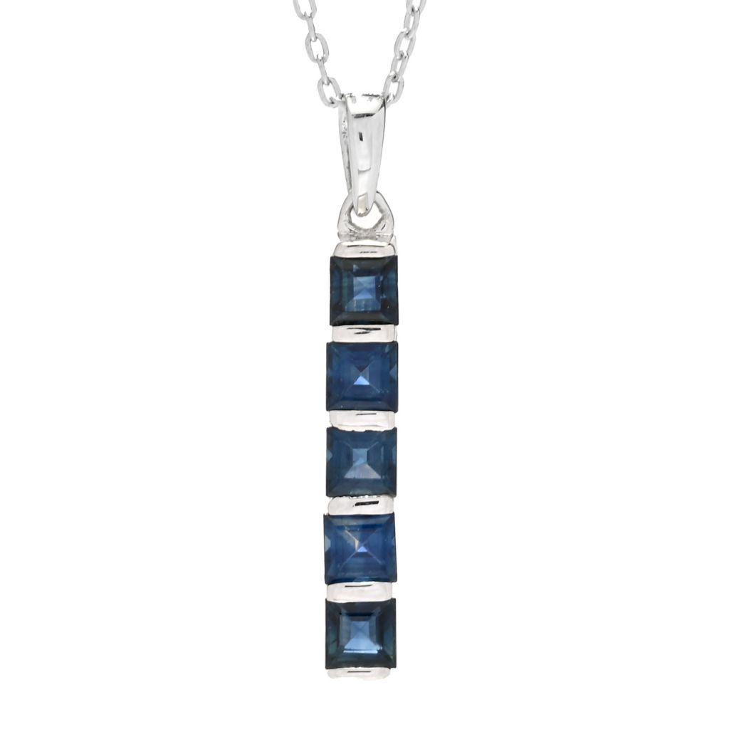 Blue sapphire necklace with a silver chain on a white background