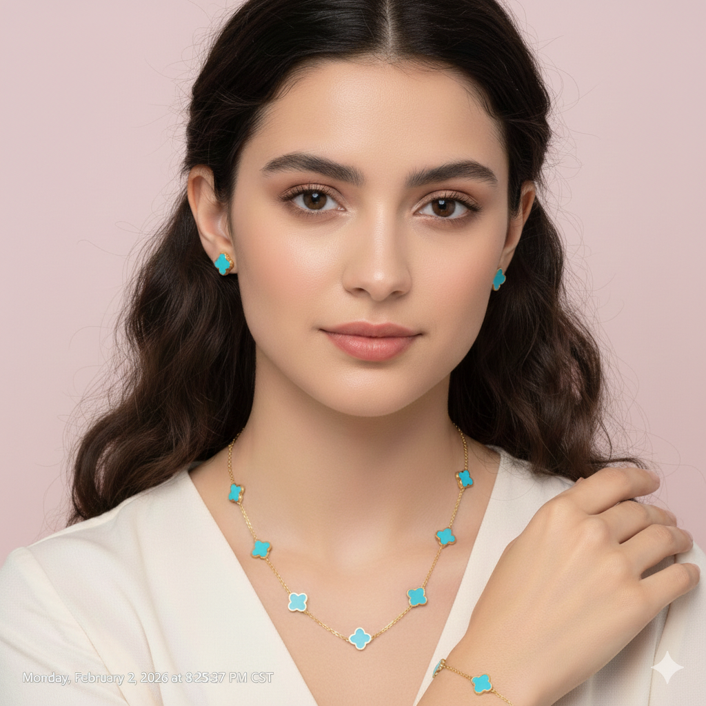 Woman wearing turquoise earrings and a necklace on a pink background