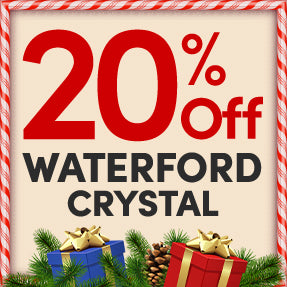 Promotional sign for 20% off Waterford Crystal with Christmas-themed decorations.