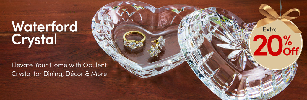 Two crystal bowls with jewelry on a wooden surface, promotional text for Waterford Crystal.