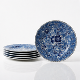 Set of blue floral ceramic plates on a white background