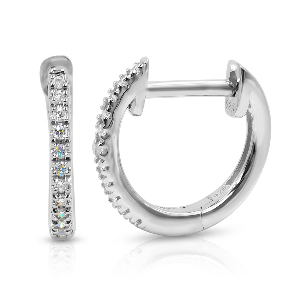 Silver hoop earrings with diamonds on a white background