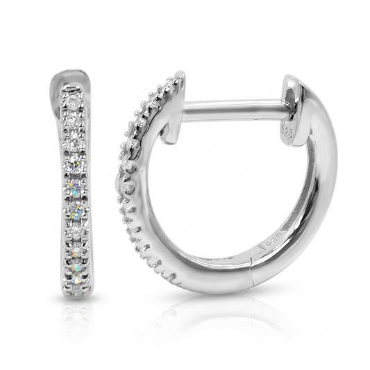 Silver hoop earrings with diamonds on a white background