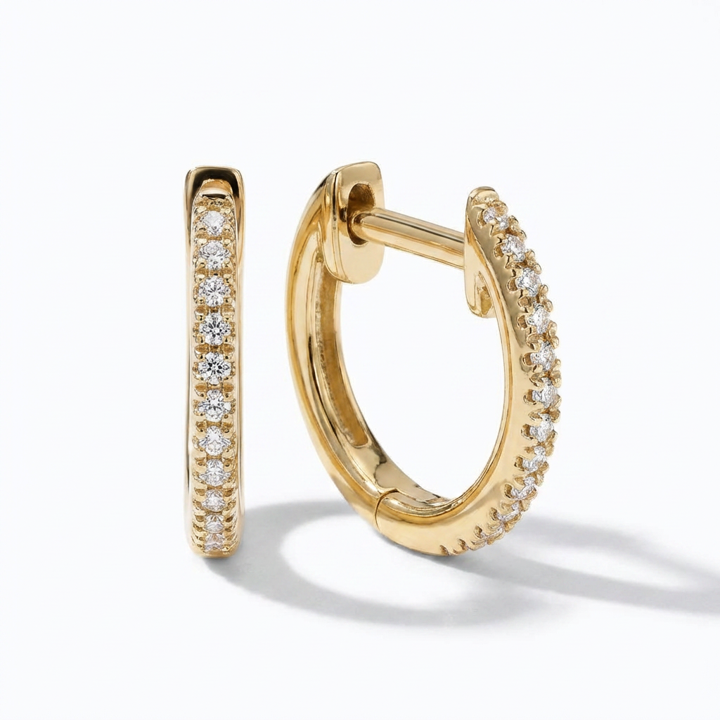 Gold hoop earrings with diamond accents on a white background