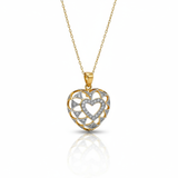 Heart-shaped gold and silver pendant on a white background