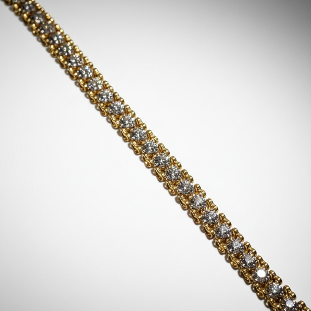 Gold bracelet with diamonds on a light gray background