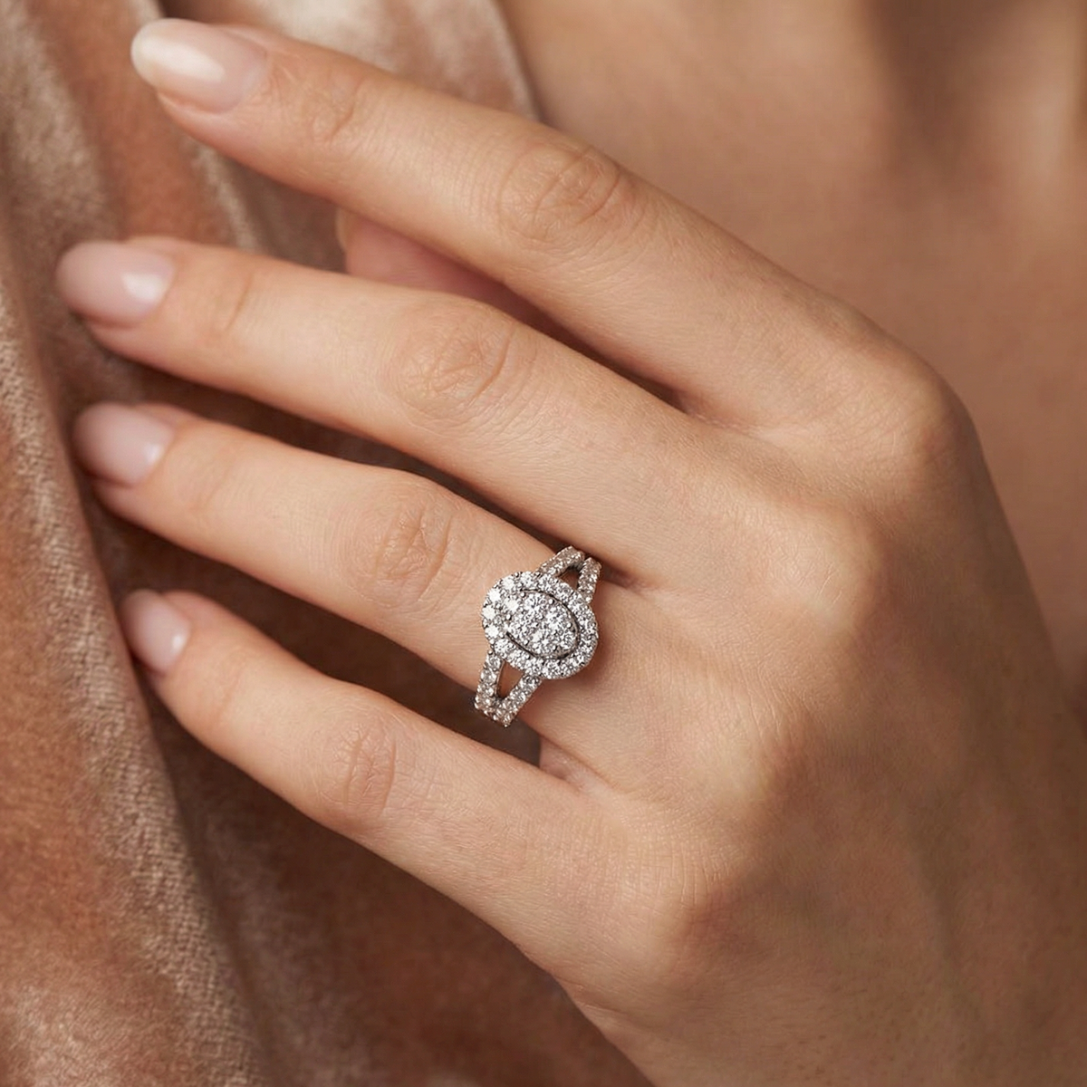 Close-up of a hand wearing a diamond ring with a soft focus background