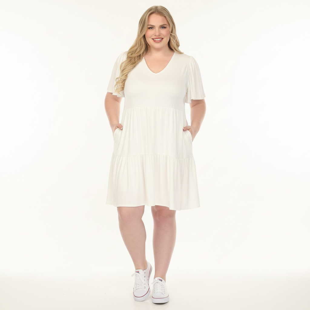 Woman wearing a white dress on a white background