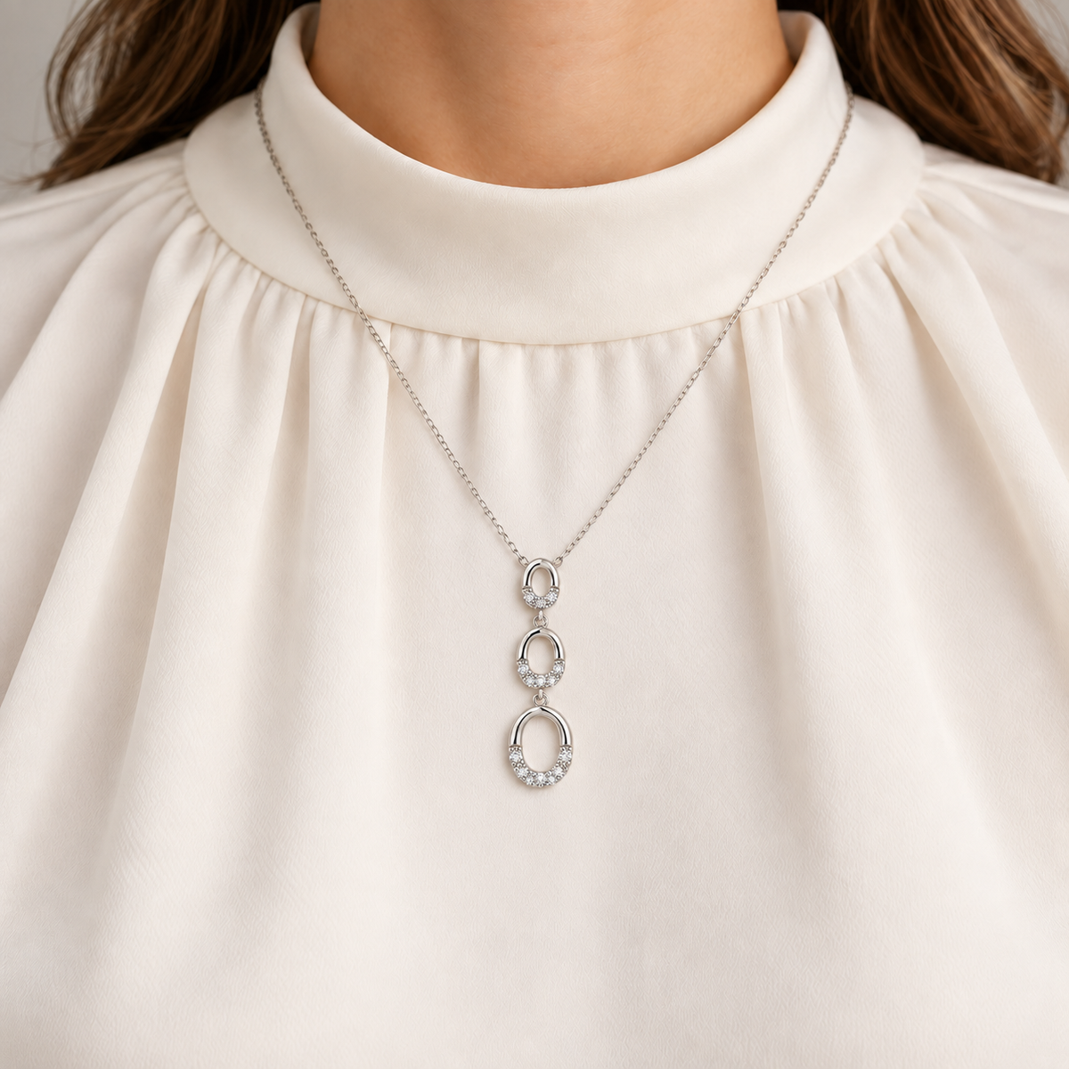 Sterling Silver 0.10ctw Diamond Graduated Oval Drop Pendant with Chain