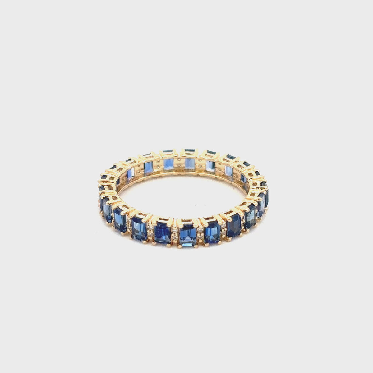 Load video: Gilded Lane 14K Gold Baguette Ceylon Blue Sapphire &amp; Diamond Eternity Ring