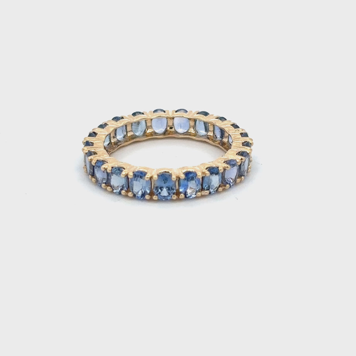 Load video: Gilded Lane 14K Gold 4x3mm Ceylon Blue Sapphire Eternity Band Ring