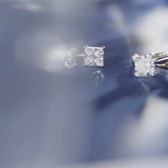 Close up video of princess cut lab-grown diamond earrings and rings